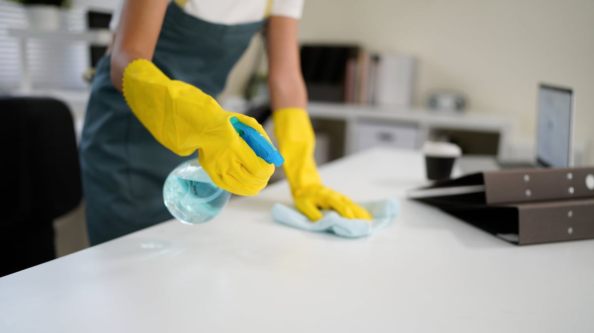 Professional home cleaning with disinfectant and cloth